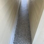 Skilled epoxy flooring between buildings.